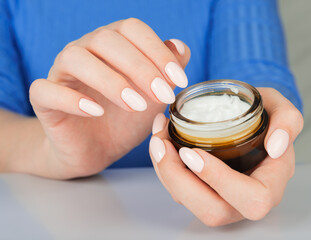 beautiful woman hands with cream.