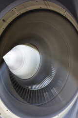 running jet engine turbine with fast turning fan blades - close-up