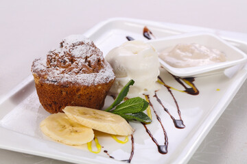 Tasty hot muffin with ice cream