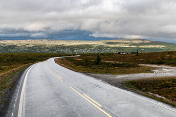 road in the mountains with dark sky and beautiful light