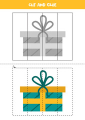 Cut and glue Christmas present box. Educational worksheet for kids.