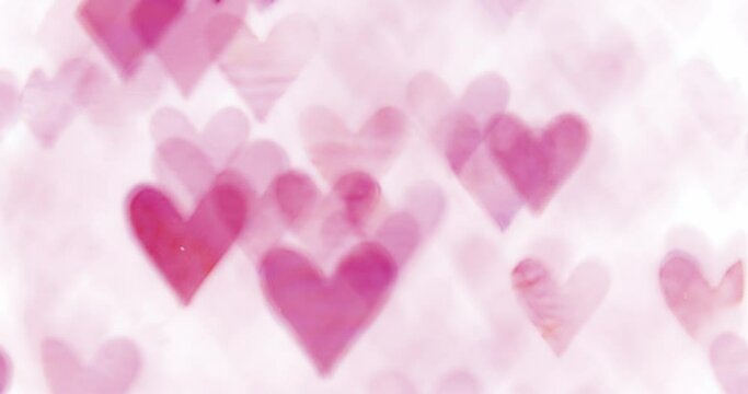 Glowing pink hearts flickering and floating. Romantic Valentine's day background.