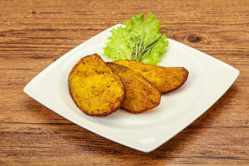 Baked potato with herbs and spices