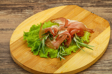 Sliced pork Jamon with rosemary