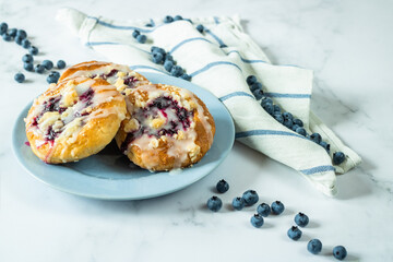 Buns with filling sprinkled with blueberries