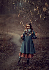 Girl in the naked spring forest