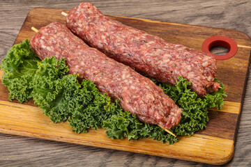 Raw minced beef kebab skewer