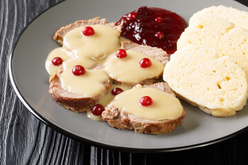Comfort food from the Czech Republic Svickova na smetane close-up in a plate on the table. Horizontal