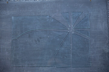 Pieces of broken glass standing on black background
