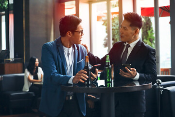 Executive business people greeting and meeting with partner or friends, alcohol drink hang out party and smile cheers together after work