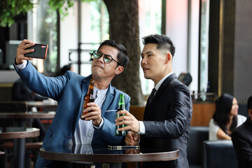 Executive business people greeting and meeting with partner or friends, alcohol drink hang out party and smile cheers together after work