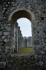 Old stone window at Old Roman antic site Fulfinium Mirine near Omisalj on Krk island, Croatia