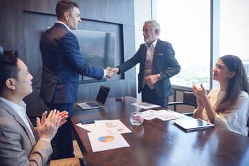 Executive business people wear suit have meeting and talking and discussing in conference room, leader present result and idea to the team by using tablet and document and handshake agreement admire