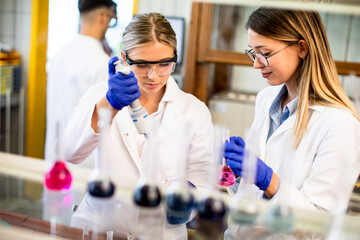 Female researchers in white lab coat working in the laboratory
