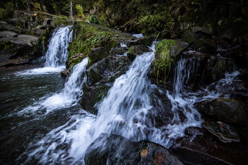Fototapeta premium Rapid mountain river with a waterfall in the national park