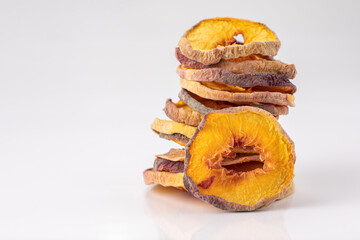 slices of dried peach on a white background. dried fruits. eco. macro.
