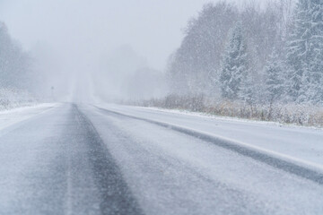 Fototapeta na wymiar Blizzard on a winter road