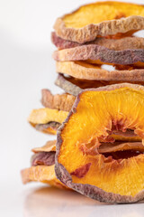 slices of dried peach on a white background. dried fruits. eco. macro.