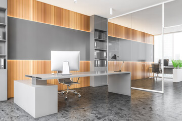 Gray and wooden CEO office corner