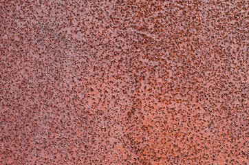 background of textured red old rust on metal