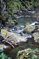 Rapid mountain river with a waterfall in the national park