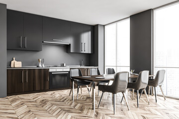 Gray kitchen corner with cupboards and table