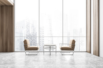 Two brown chairs against each other in business lobby, view on skyscrapers