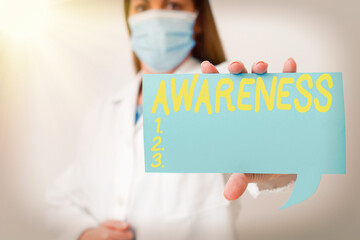 Conceptual hand writing showing Awareness. Concept meaning quality or state of being aware of...