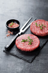 Raw fresh ground beef meat burgers steak cutlets, selective focus