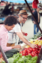 Sales of fresh and organic vegetables and  fruits at the green market or farmers market.  Buyers choose and buy products for healthy food in grocery. All for diet healthy eating, lifestyle.