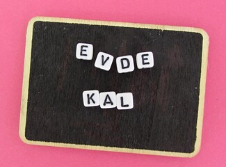 Fototapeta na wymiar Evde Kal - Lettering Stay at home in turkish language