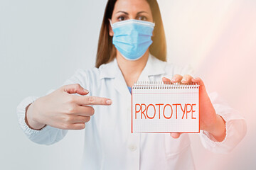 Writing note showing Prototype. Business concept for first and usually functional form of a new...