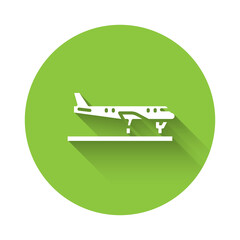 White Plane icon isolated with long shadow. Flying airplane icon. Airliner sign. Green circle button. Vector.