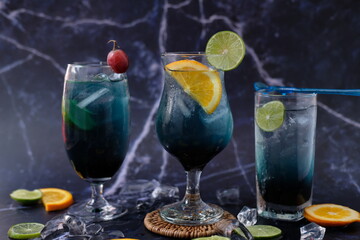 cocktails selection with lemonade and vodka on table background