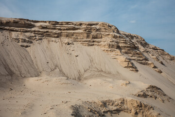 Heaps of sand washed up from the river that look like rocky mountains