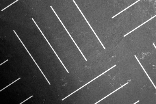 evocative black and white texture of drawing with oblique lines parallel to each other