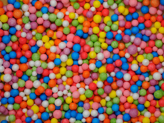 Fototapeta na wymiar Background texture of multicolored foam balls