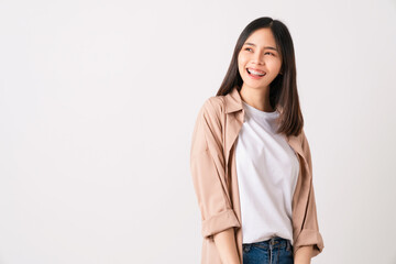 Studio shot of cheerful beautiful Asian woman in light color T-shirt and stand on white background.