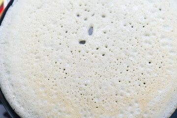 big round pancake on electric frying pan