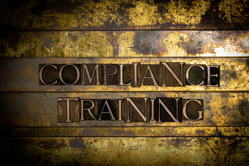 Compliance Training text message on textured grunge copper and vintage gold background
