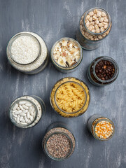 Set of glass jars with various ingredients placed on a table. Zero waste concept. Top view