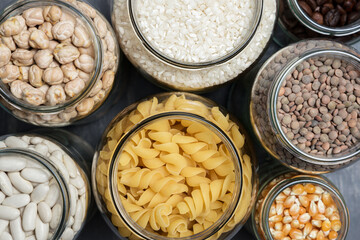 Set of glass jars with various ingredients placed on a table. Zero waste concept. Top view