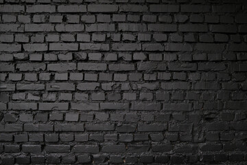 Fototapeta na wymiar Old black brick wall. Grunge black vintage background