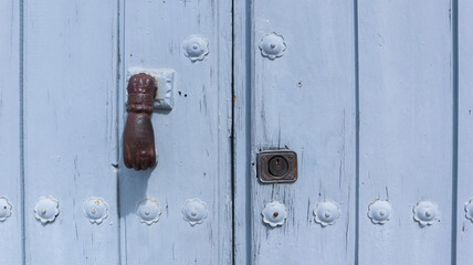 colored wooden doors with metal knobs