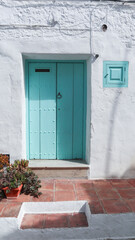 colored wooden doors with metal knobs