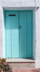 colored wooden doors with metal knobs