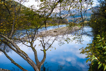 River in the mountains with pebbles in autumn