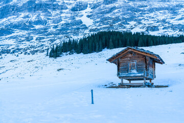 Winter landscape with snow covered peaks on Kleine Scheidegg mountain in Swiss Alps near Grindelwald, Switzerland