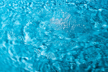 splash of water on a blue background. Abstract wallpaper
