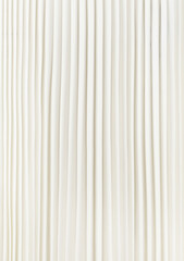 Fototapeta premium Part of white skirt with stripes close up